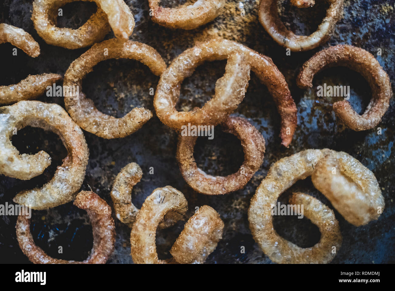 High angle close up of freshly made Puffed Pork Scratchings. Stock Photo