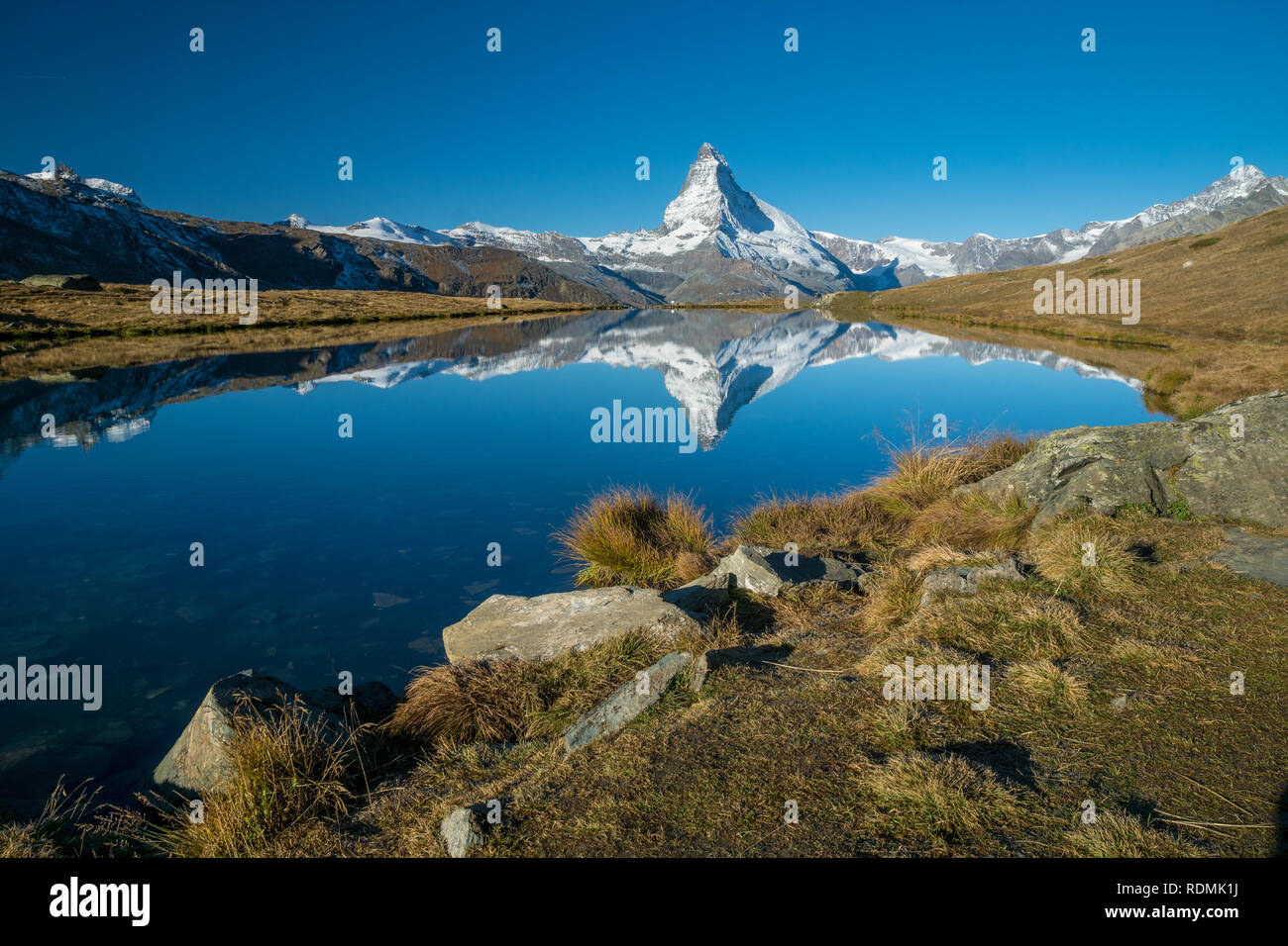 reflection of matterhorn in mountain lake in the early morning Stock Photo