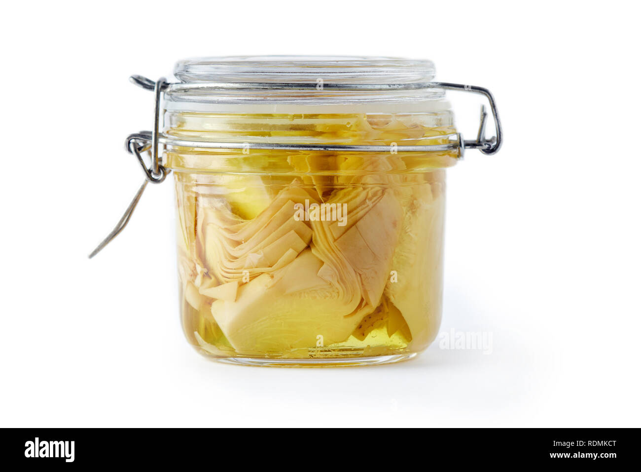 Pickled marinated artichokes in a glass jar isolated on white