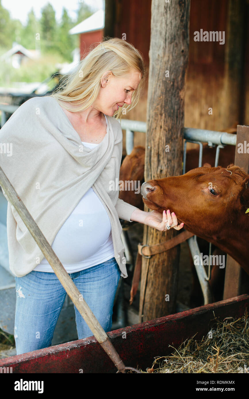 Pregnant woman on farm Stock Photo Alamy
