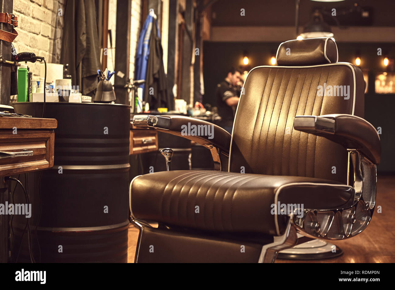 Close up brown leather chair in barbershop. Loft style Stock Photo - Alamy