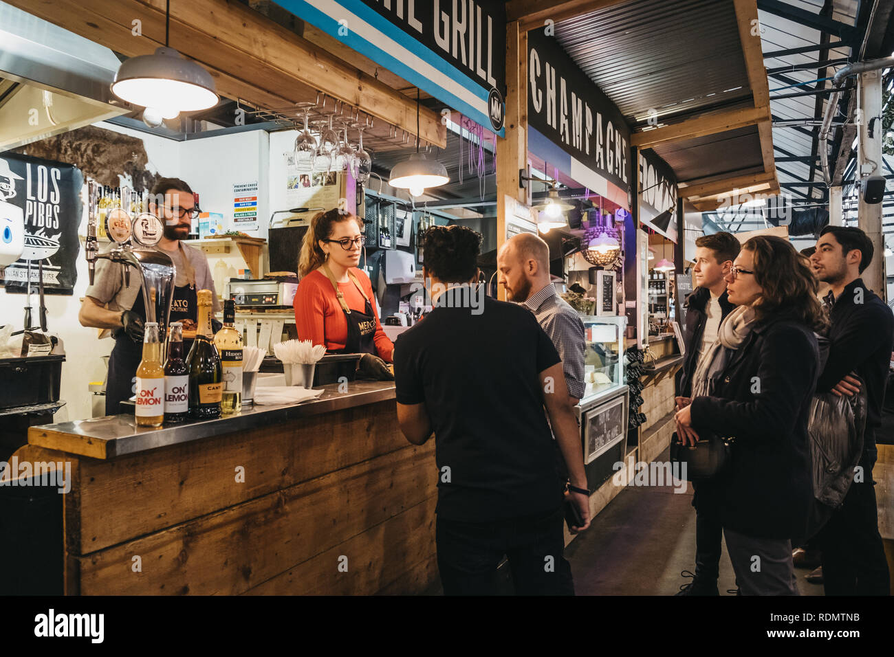 London, UK - January 13, 2019: People inside Mercato Metropolitano, the first sustainable community market in London focused on revitalising the area  Stock Photo