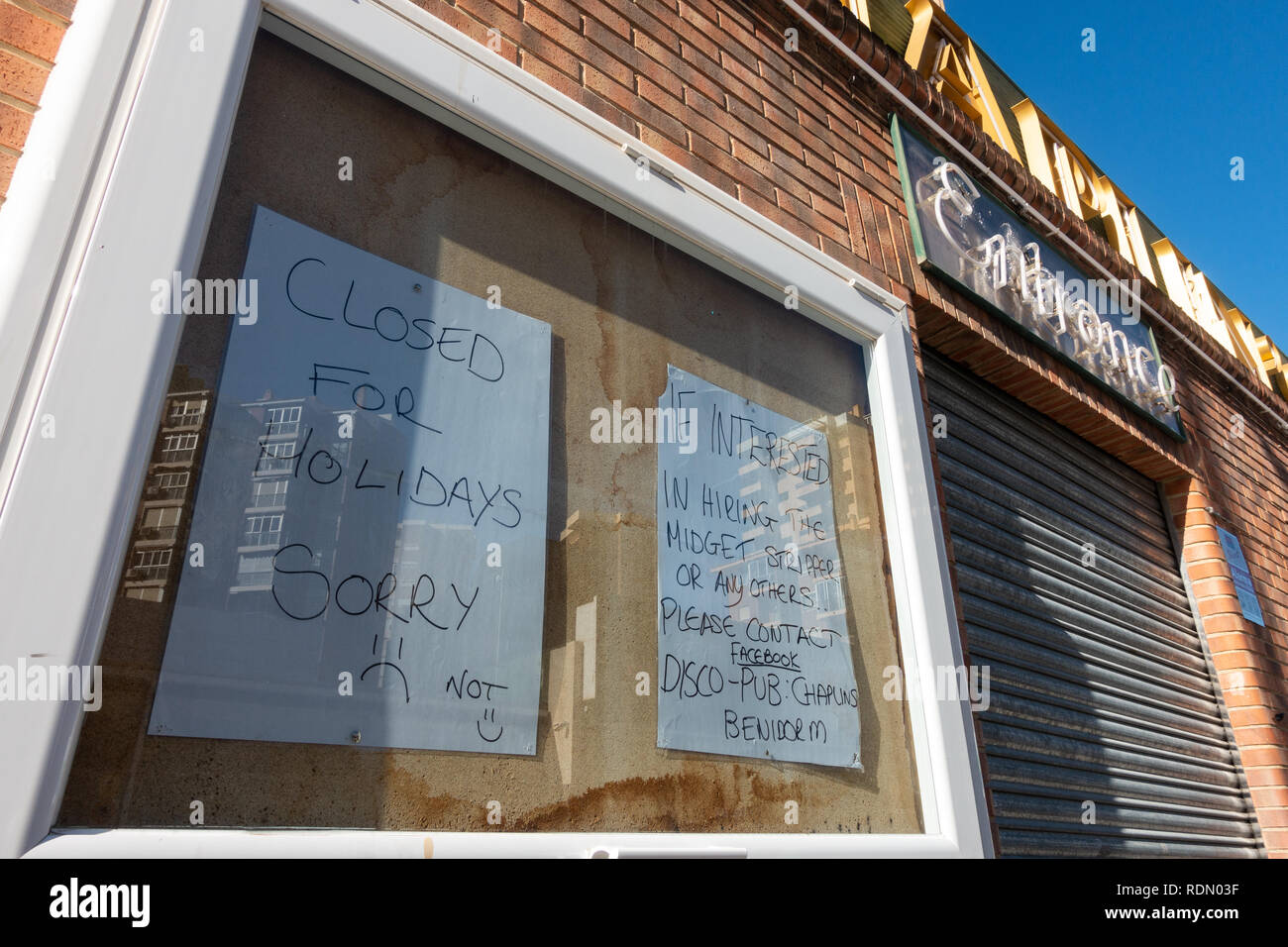 Wanna rent a midget, sign outside a nightclub in Benidorm, Costa Blanca, Spain Stock Photo