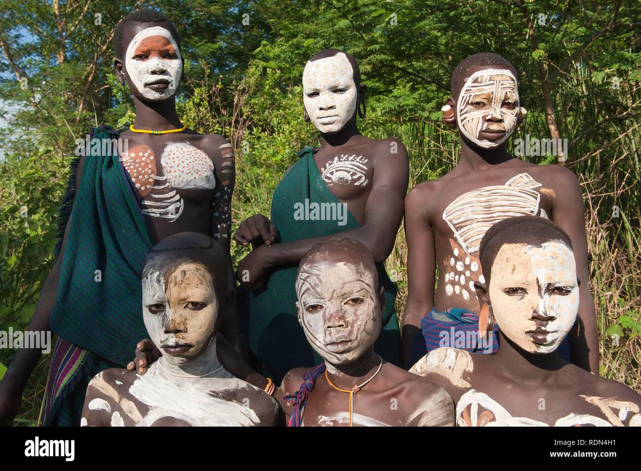 Group of Surma Woman with facial and body paintings, Kibish, Omo River Valley, Ethiopia, Africa Stock Photo