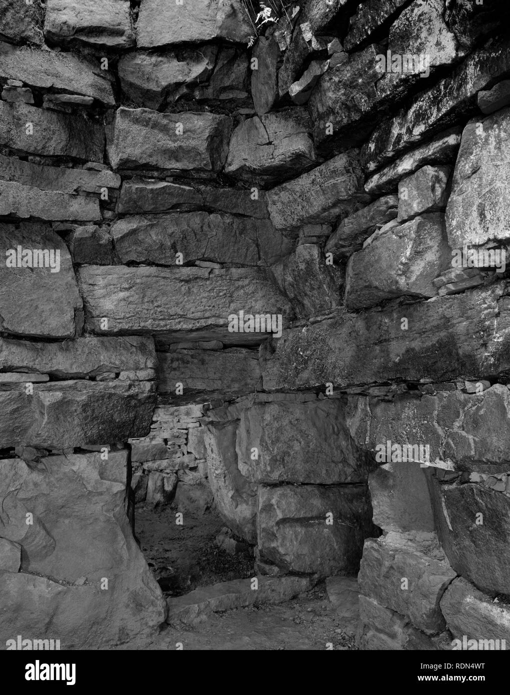 View WSW of the main chamber of Vinquoy Hill Neolithic chambered cairn, Eday, Orkney, UK, showing entrances to the western pair of side chambers. Stock Photo
