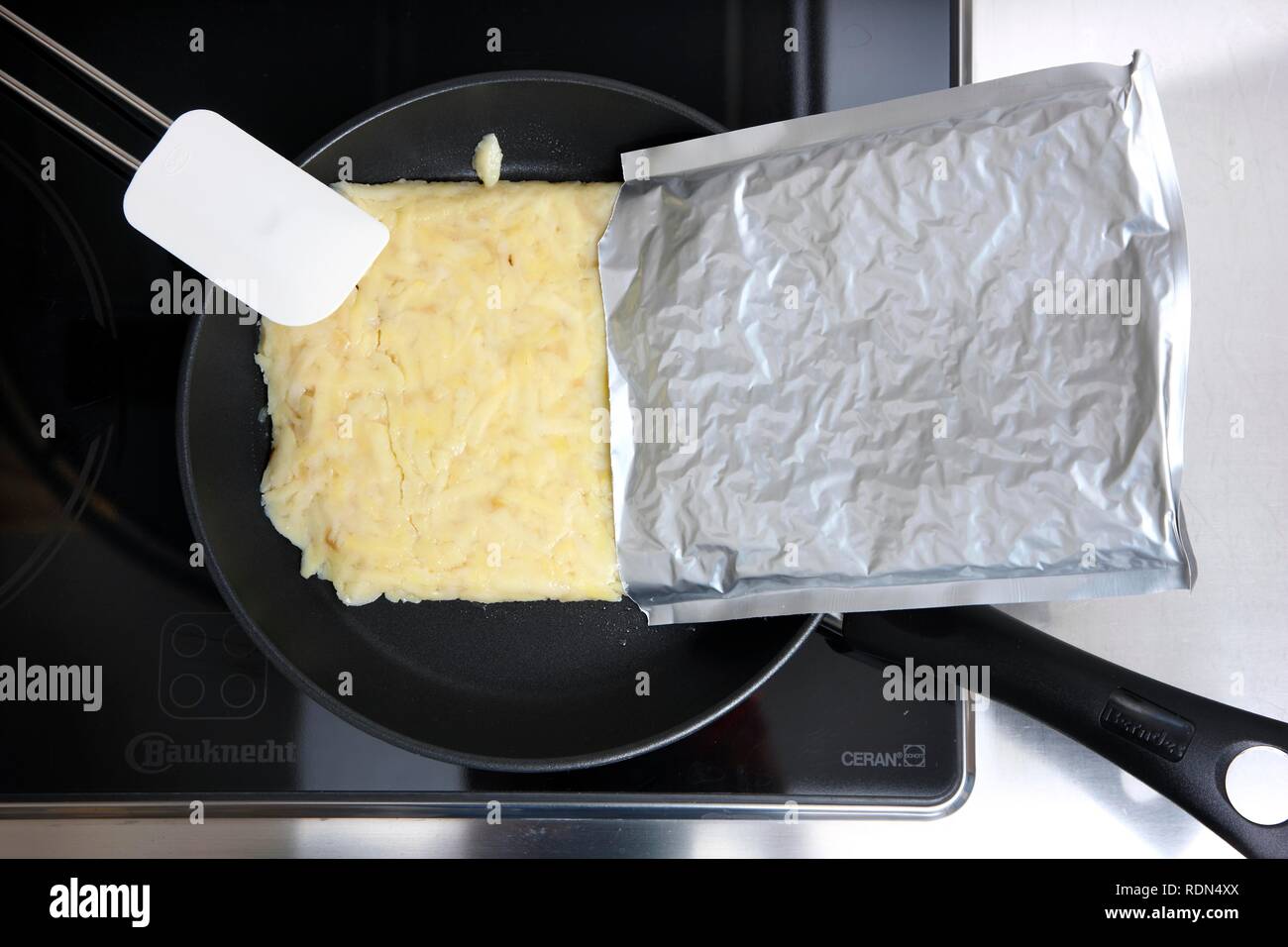 Hash browns, ready for the pan in an aluminum packaging Stock Photo