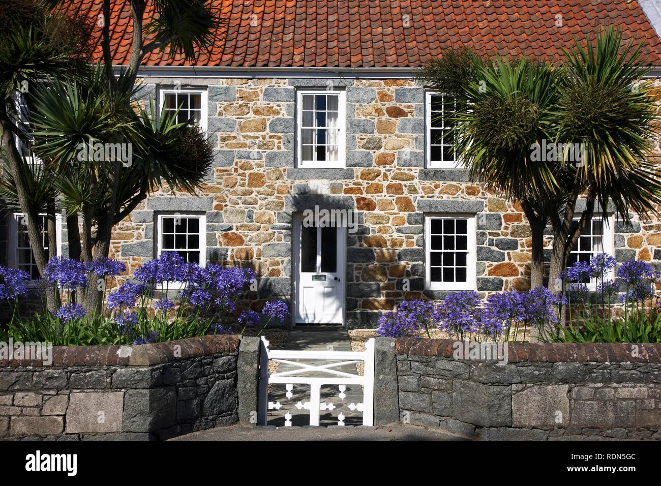 Typical Guernsey house made from solid stone and granite, with many