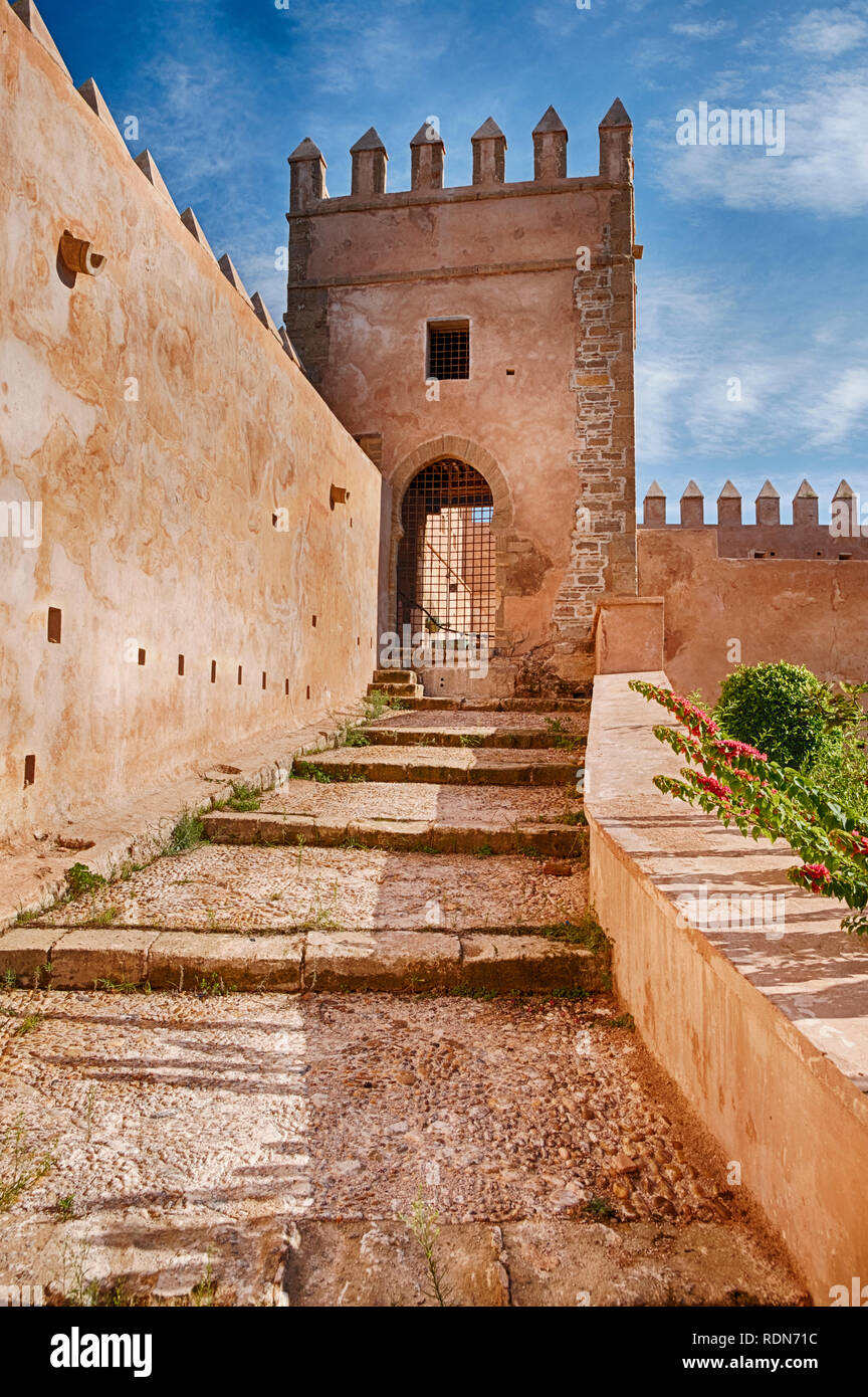 A ramp with steps leads upwards towards one of the guard towers that are located on the outside walls of the Kasbah in Rabat, Morocco. Stock Photo