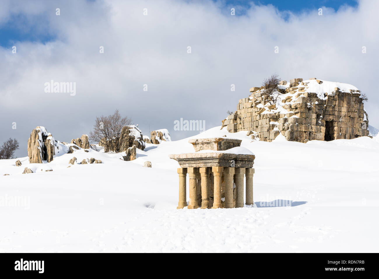 Tower of Caudius and the small altar covered in snow during winter, Faqra Roman ruins, Lebanon Stock Photo
