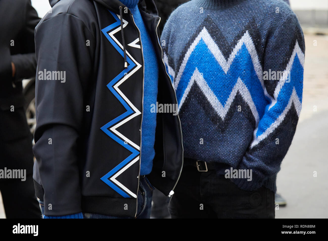 MILAN, ITALY - JANUARY 12, 2019: Men with blue, white and black geometric design jacket and sweater before Frankie Morello fashion show, Milan Fashion Stock Photo