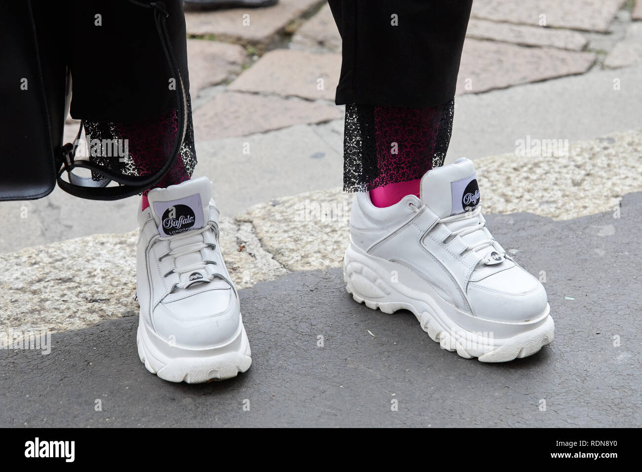 MILAN, ITALY - JANUARY 12, 2019: Man with white Buffalo shoes and pink  socks before Frankie Morello fashion show, Milan Fashion Week street style  Stock Photo - Alamy
