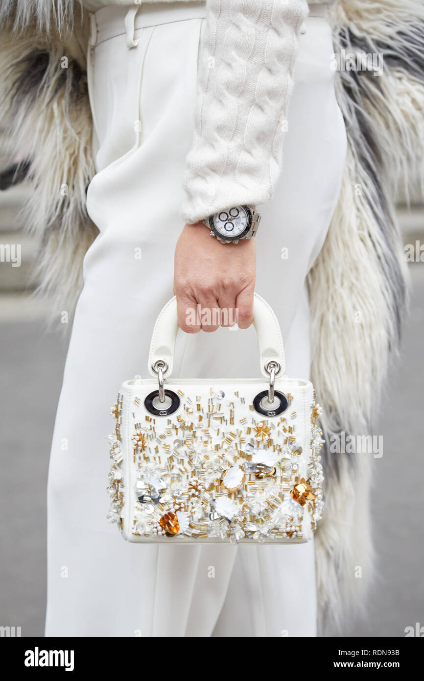MILAN, ITALY - JANUARY 12, 2019: Woman with Dior white leather bag with  golden details and Rolex Daytona watch before Frankie Morello fashion show,  Mi Stock Photo - Alamy