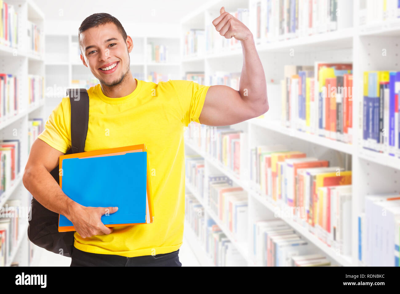 Student young man success successful strong power library education people learning Stock Photo