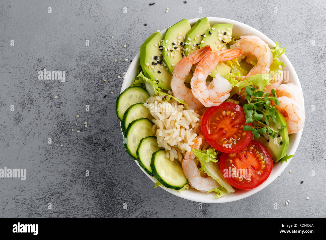 Hawaiian poke bowl with shrimps, rice and vegetables, healthy Buddha ...
