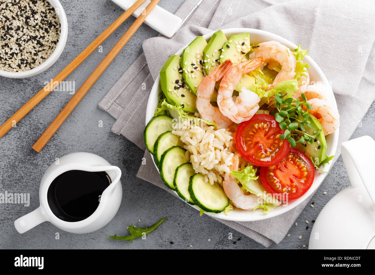 Hawaiian poke bowl with shrimps, rice and vegetables, healthy Buddha ...