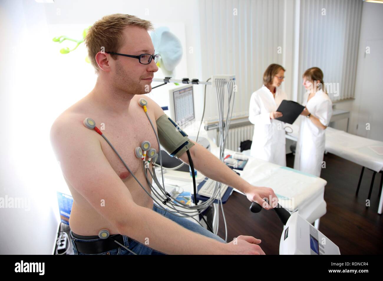 Medical practice, stress ECG, test to measure the cardiac function of a patient on a cardio machine Stock Photo