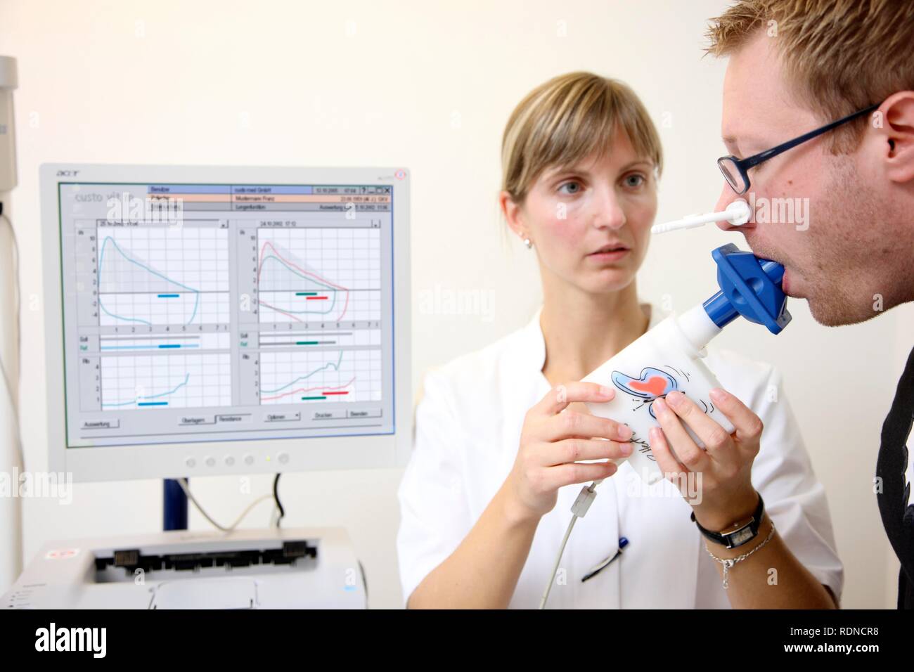 Medical practice, patients doing a lung capacity lest Stock Photo