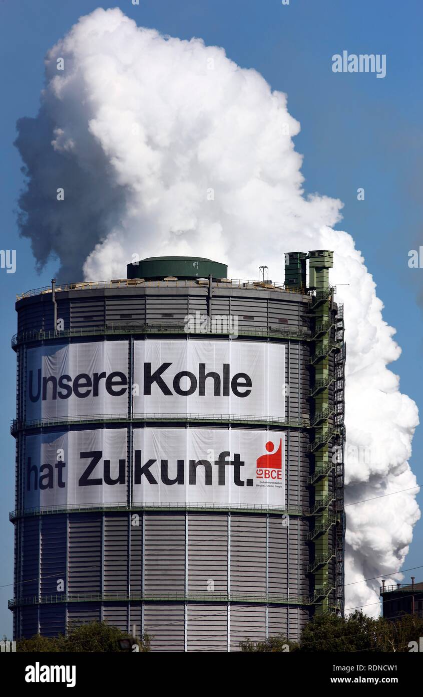 Gas holder, Kokerei Prosper coking plant with a large poster of the IGBCE trades union with a lettering 'Unsere Kohle hat Stock Photo