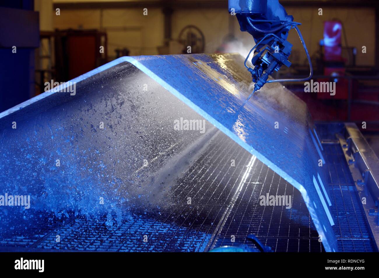 Water jet technology, precise technology for cutting metal with a high pressure water jet, where an abrasive material is added Stock Photo