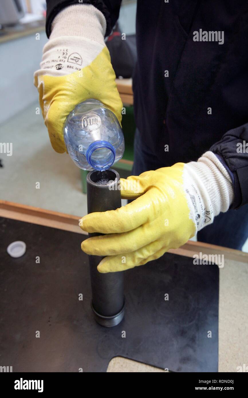 Loading a water gun on a radio control robot from the Telerob company to defuse explosives, bombs and other dangerous devices by Stock Photo