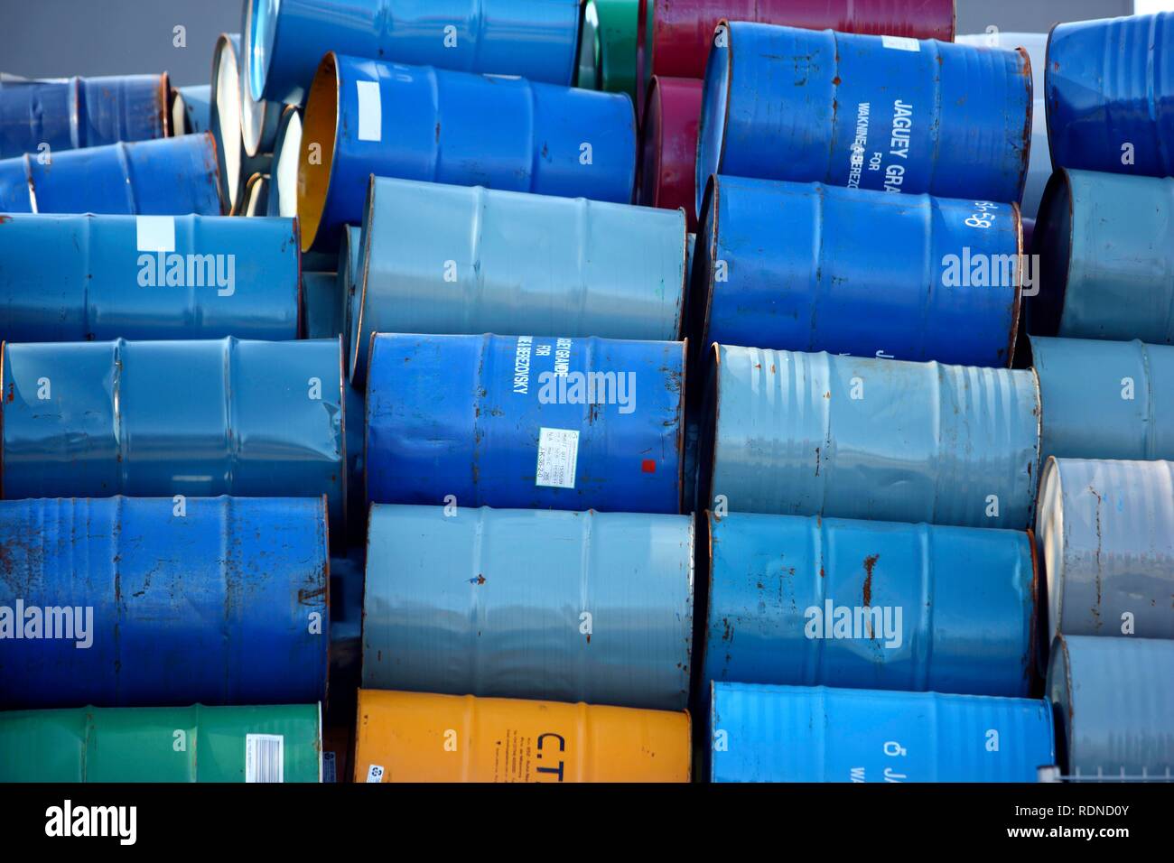 Empty metal drums used for chemicals stockpiled in a recycling company