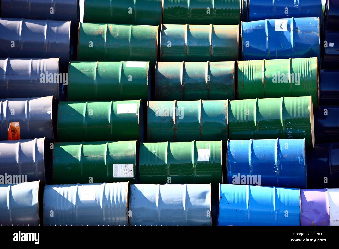 Empty metal drums used for chemicals stockpiled in a recycling company