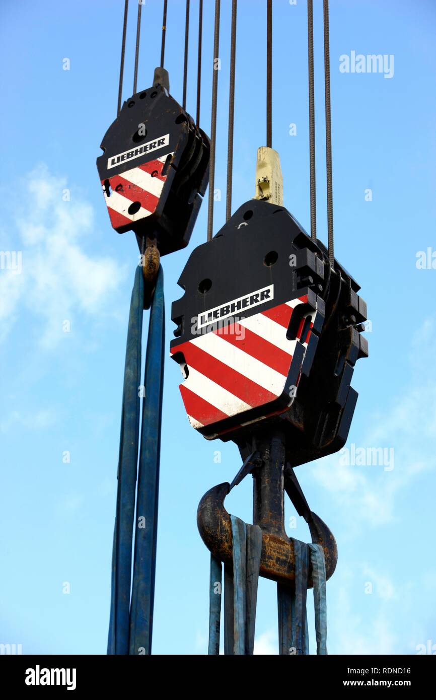 Crane hooks of a large mobile crane with rope loops to secure loads Stock Photo