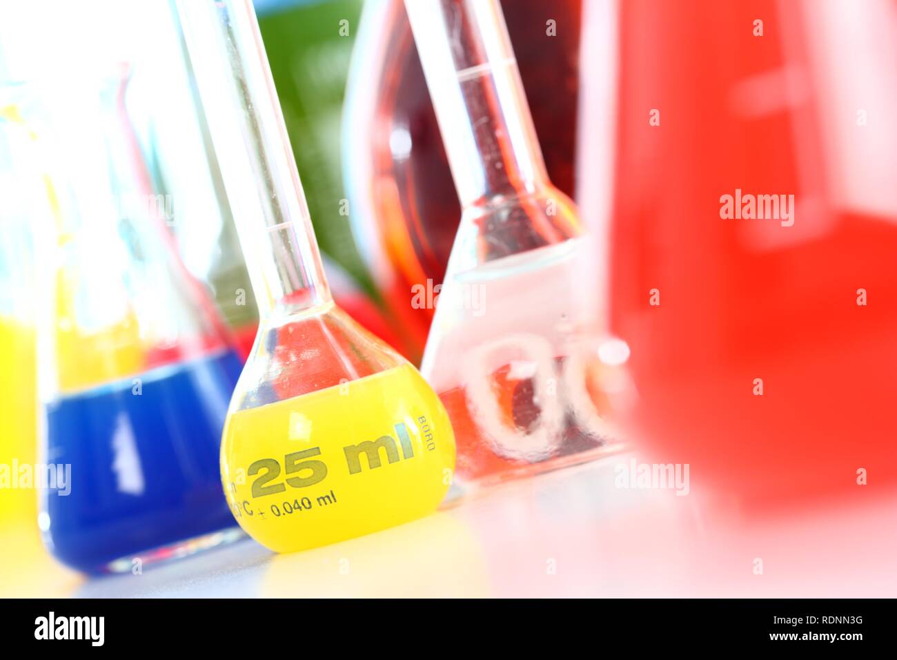 Chemistry laboratory, various glass containers with liquids, chemicals, in various colors Stock