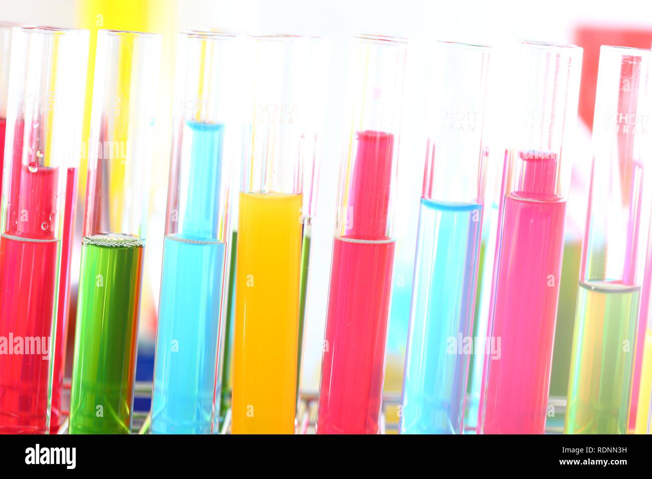 Chemistry laboratory, various glass containers with liquids, chemicals