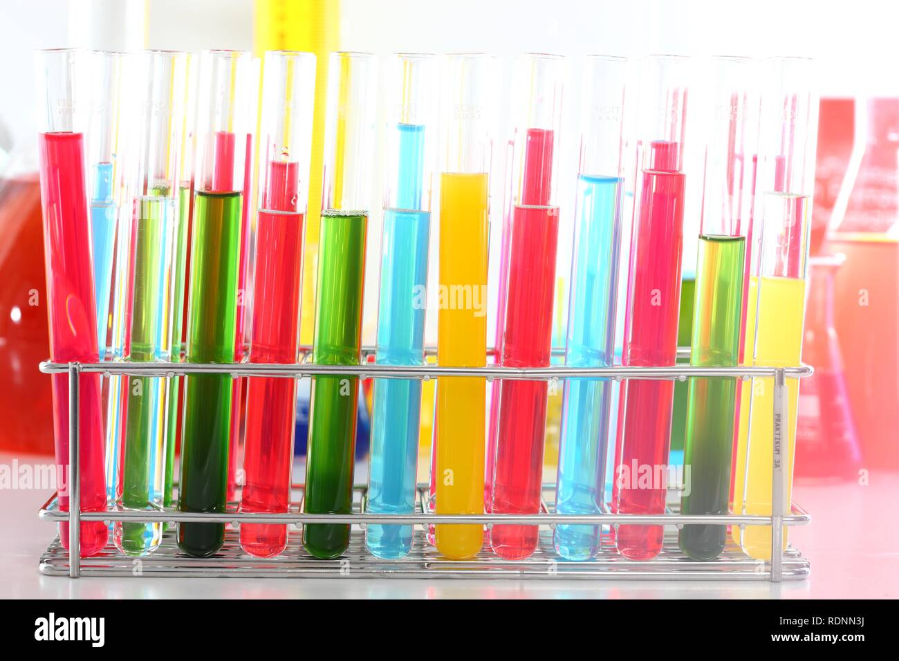 Chemistry laboratory, various glass containers with liquids, chemicals