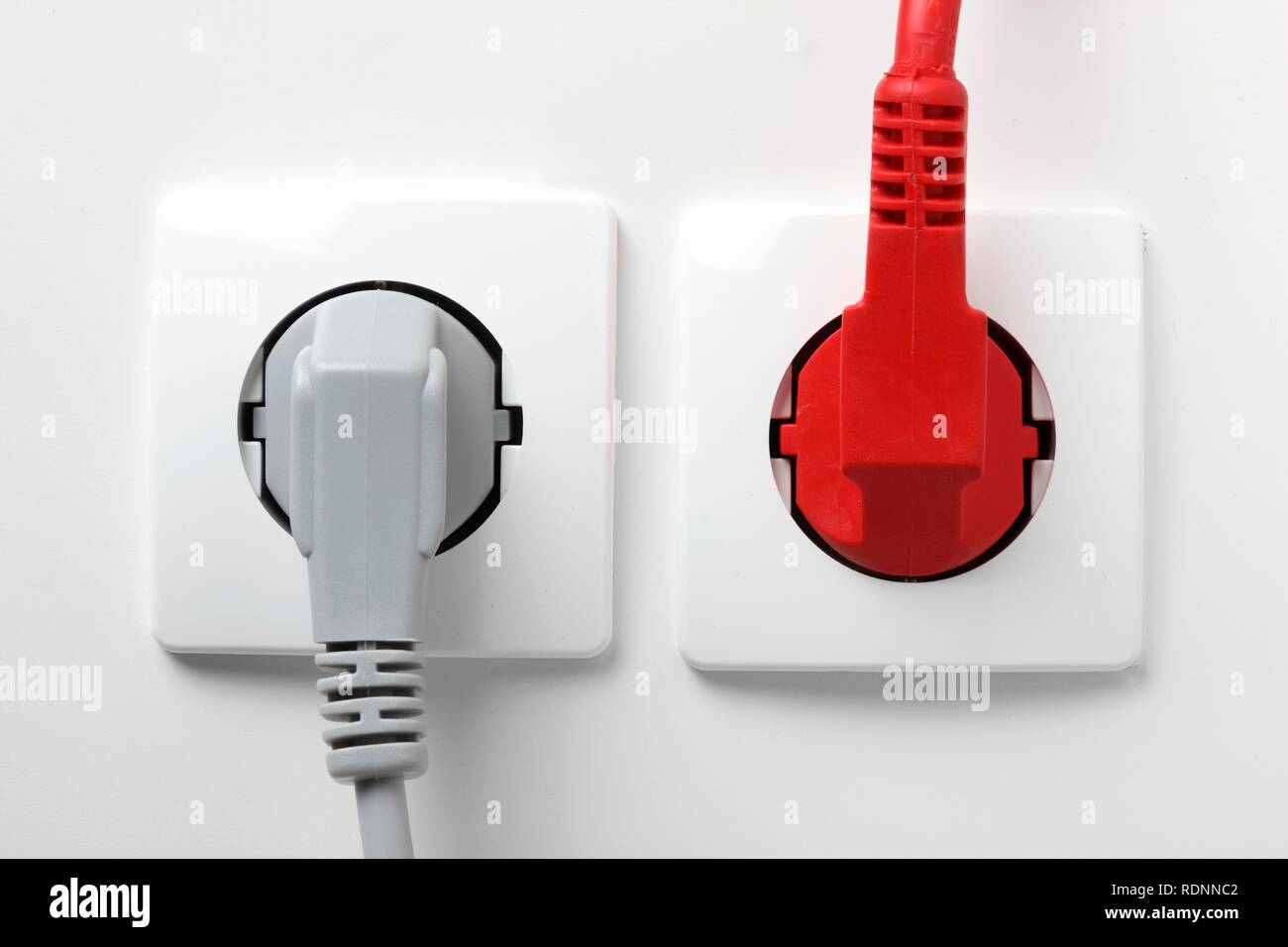 Safety plugs, two poles, in outlet, power Stock Photo