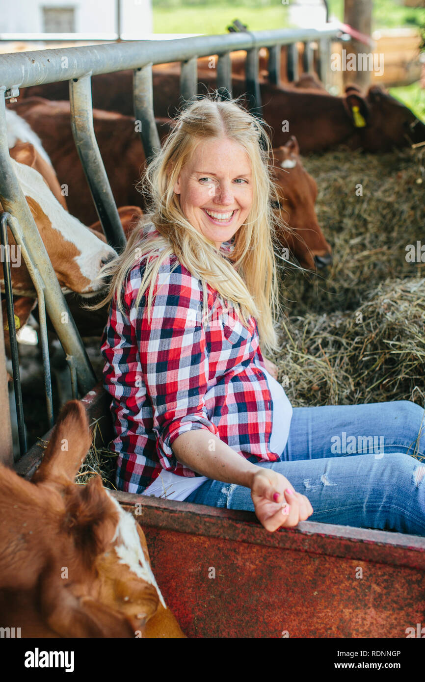 Pregnant woman on farm Stock Photo Alamy