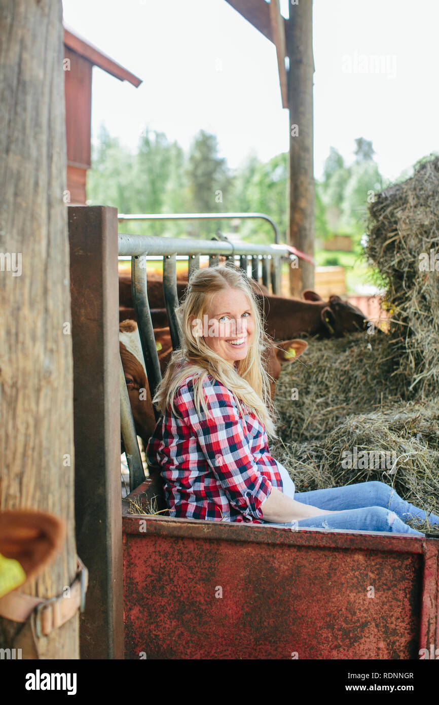 Pregnant woman on farm Stock Photo Alamy