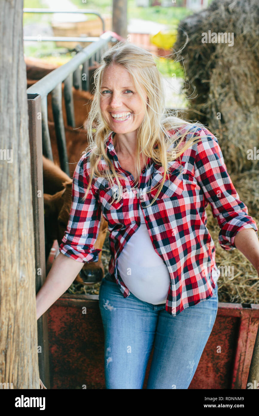 Pregnant woman on farm Stock Photo Alamy
