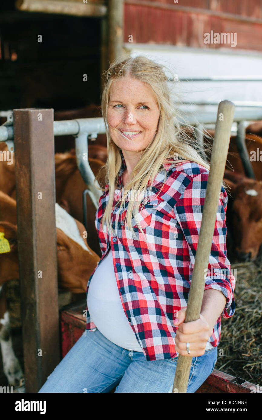 Pregnant woman on farm Stock Photo Alamy
