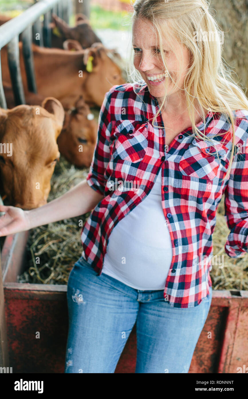 Pregnant woman on farm Stock Photo Alamy