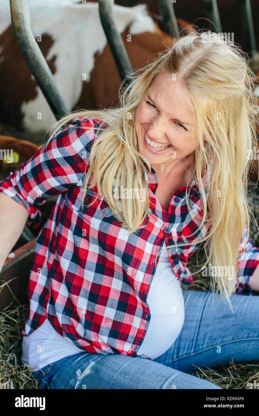 Pregnant woman on farm Stock Photo Alamy