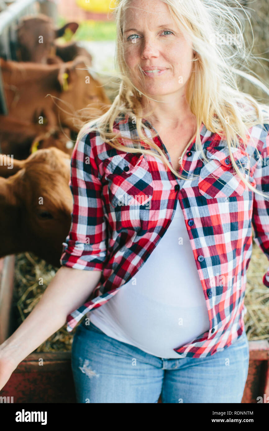 Pregnant woman on farm Stock Photo Alamy