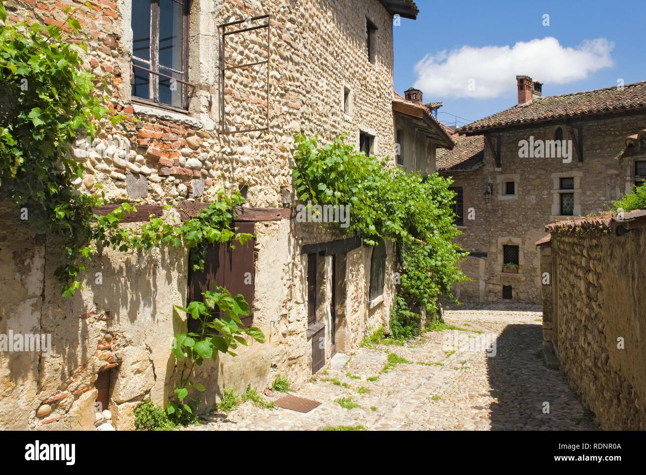 Cobblestone street, medieval walled town of Perouges, France, Europe ...