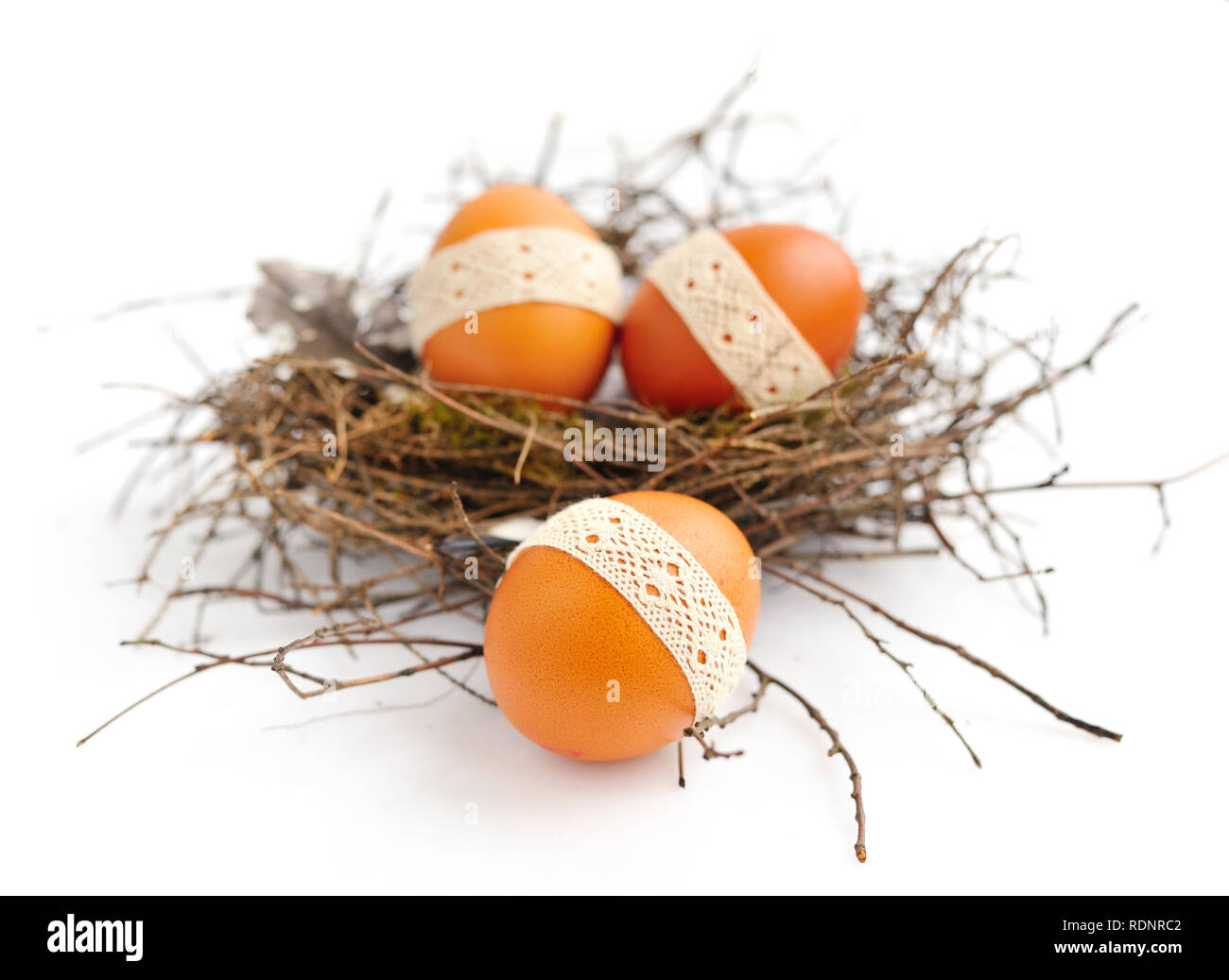 Nest with easter eggs on a white background Stock Photo - Alamy