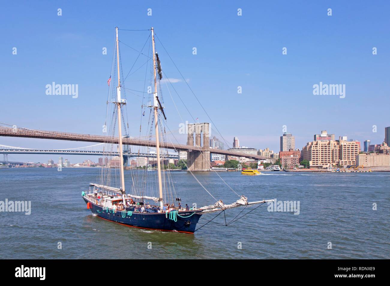 Sailing ship in front of Brooklyn Bridge, New York, USA Stock Photo