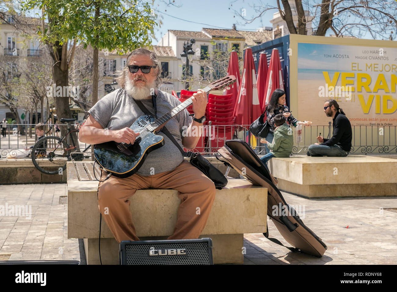 Malaga, Spain April 14, 2018. Street singer with a guitar in Merced