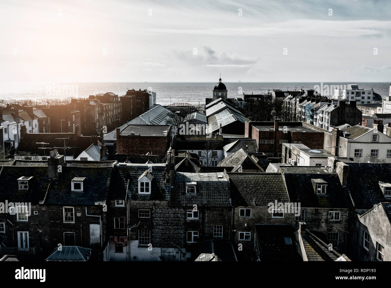 View looking over rooftops towards the sea in Worthing, West Sussex Stock Photo