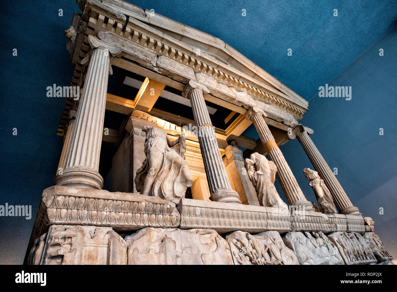 LONDON, UK - The Nereid Monument, the largest and finest of teh Lykian tombs found near Xanthos in southwestern Turkey. It is named after the figures of Nereids, the daughters of the sea god Nereus, which are placed between the columns. It was built around 390-380 BC. The British Museum, in London, is one of the largest and most comprehensive of the world's museums. It is dedicated to human history, art, and culture, and was established in 1753. The British Museum in London houses a vast collection of world art and artifacts, reflecting human history, culture, and civilizations from around the Stock Photo