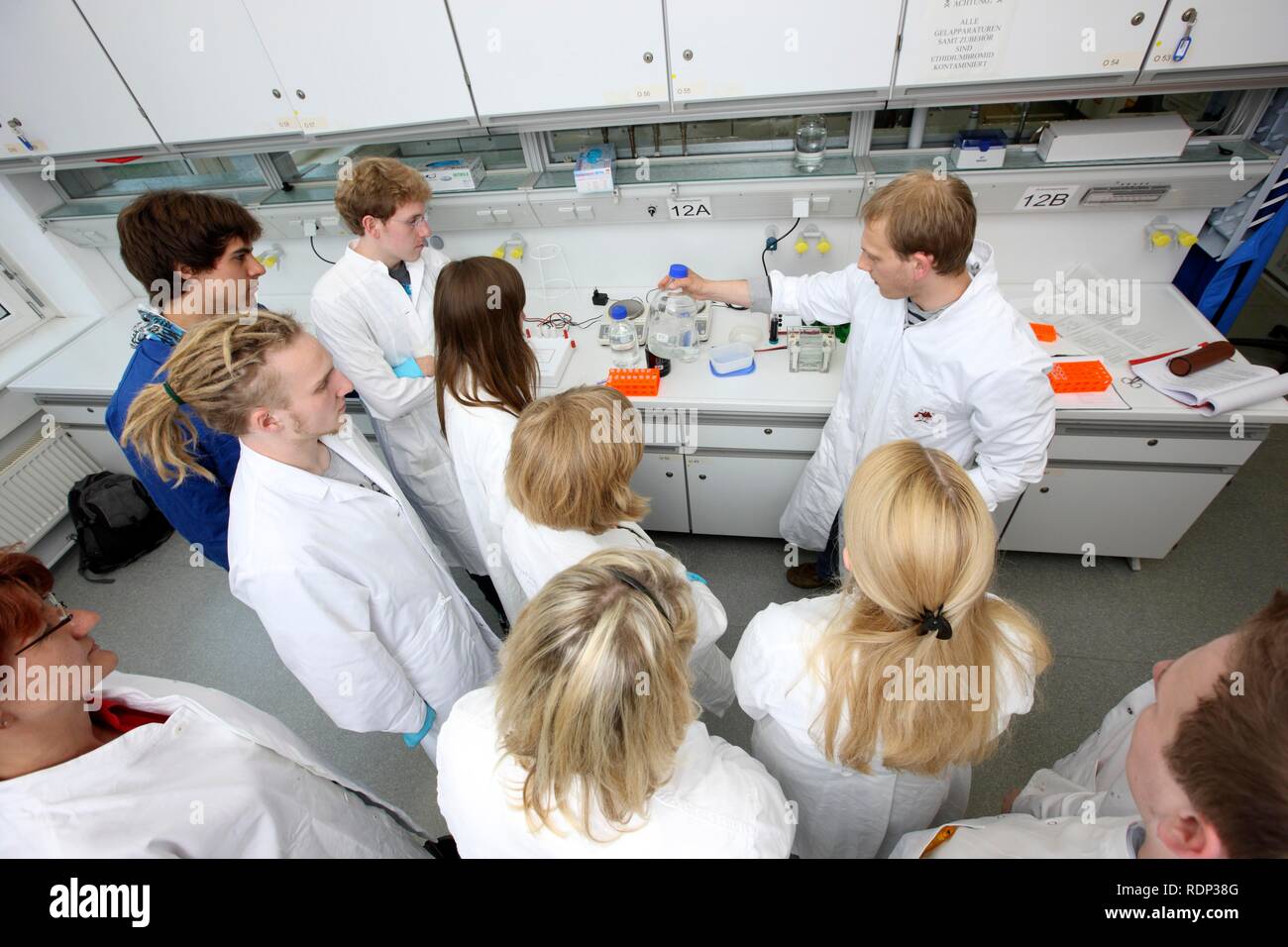 Internship leader explaining the next experiment to an internship group in a laboratory, Centre for Medical Biotechnology of the Stock Photo