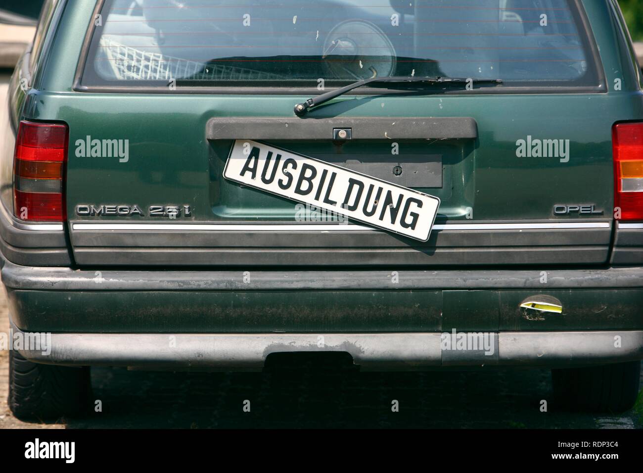 Old Opel Omega being used as a training vehicle, sign in German saying 'Ausbildung', 'training' Stock Photo