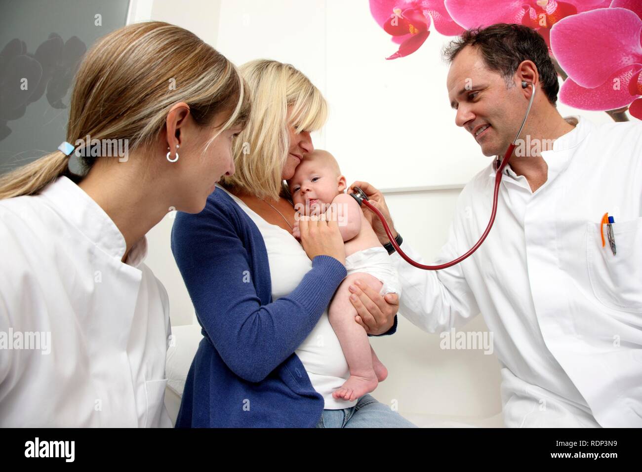 Doctor's surgery, mother and child at the paediatrician's, medical examination of an infant, preventive medical examination, Stock Photo