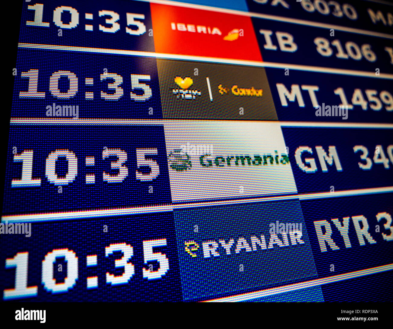 PALMA DE MALLORCA, SPAIN - MAY 11, 2018: Close-up details of a typical airport information board with mutiple airlines hours departure gates and insignia for the boarding gate Ryanair Germania Condor Iberia  Stock Photo