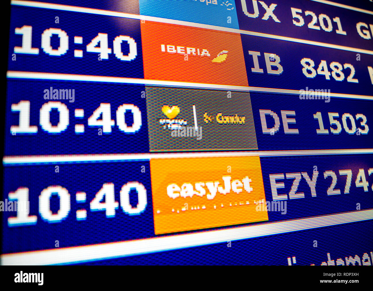 PALMA DE MALLORCA, SPAIN - MAY 11 2018: Close-up details of a typical airport information board with mutiple airlines hours departure gates and insignia for the boarding gate EasyJet Condor Iberia  Stock Photo