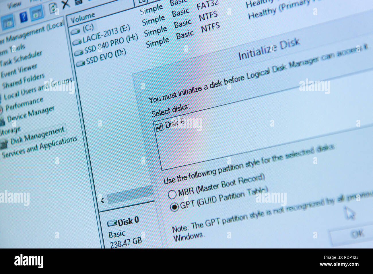 PARIS, FRANCE - FEB 17, 2015: Computer screen with window of new HDD hard drive format initialize disk with GPT Guid Partition Table Stock Photo